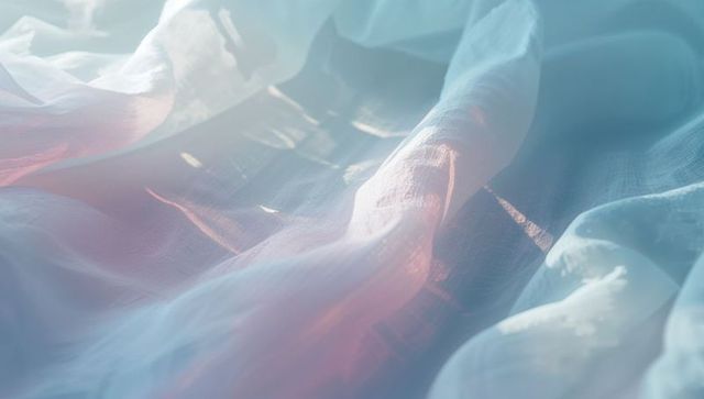 Translucent pastel fabric with soft folds and ripples