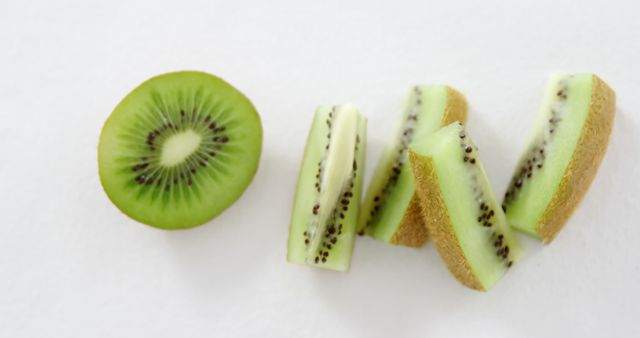 Close-up of Kiwi Fruit Sliced on White Background - Download Free Stock Images Pikwizard.com