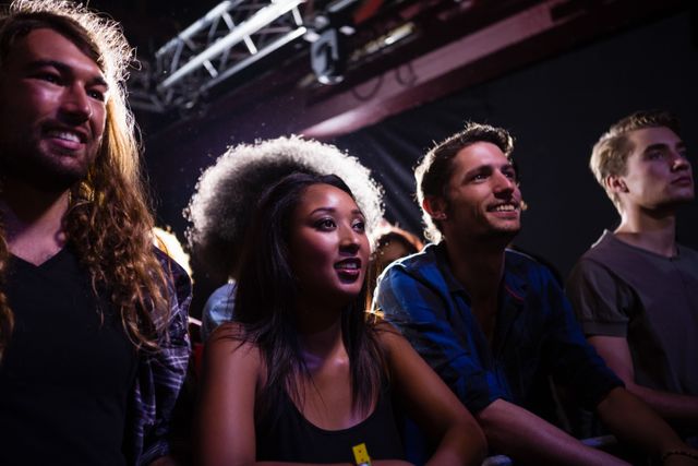 Group of Friends Enjoying Rock Concert in Nightclub - Download Free Stock Photos Pikwizard.com