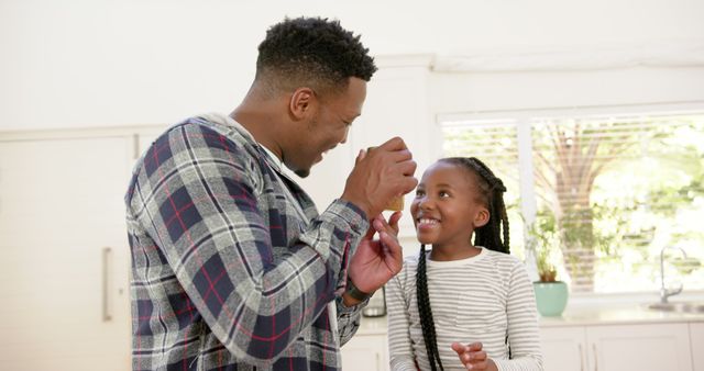 Father and Daughter Smiling and Sharing a Playful Moment Together - Download Free Stock Images Pikwizard.com