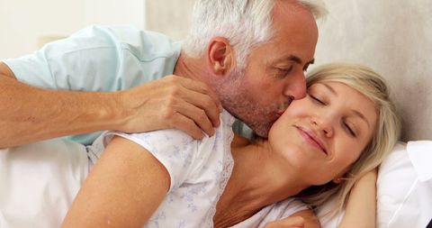 Elderly Couple Relaxing and Smiling in Cozy Bedroom - Download Free Stock Images Pikwizard.com