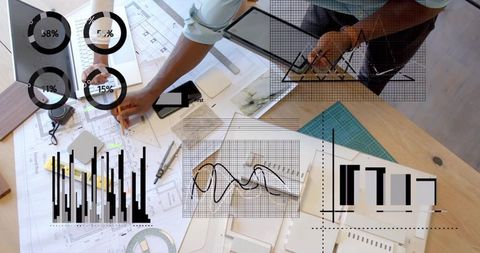 Architects Collaborating on Blueprints with Data Analytics Overlay