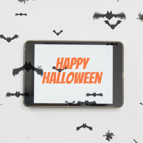 halloween greetings on tablet surrounded by bats - Download Free Stock Templates Pikwizard.com