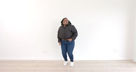 Joyful Woman Dancing Energetically in Casual Attire
