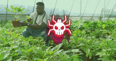 Kneeling gardener inspecting potted plant in greenhouse with neon skull-spider overlay