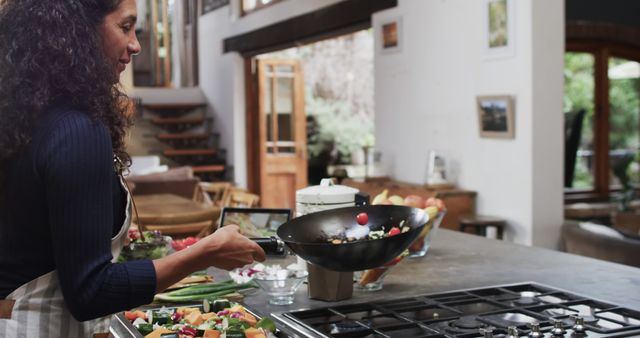 Woman Cooking Healthy Vegetable Stir Fry in Modern Kitchen - Download Free Stock Images Pikwizard.com