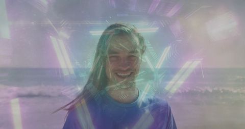 Young man smiling at beach with pastel geometric double exposure and dreamy lens flare