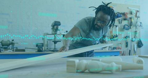 Carpenter Measuring Plank in Workshop with Tools and Equipment