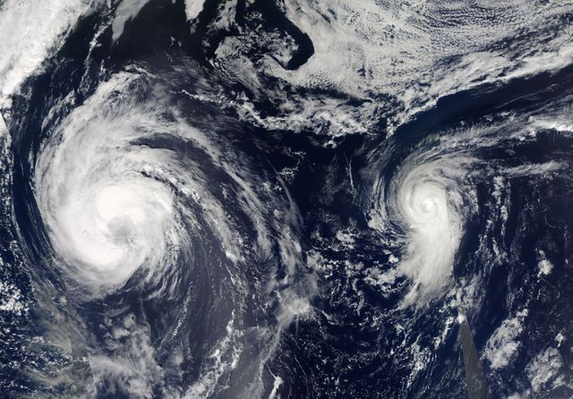 This visible image of Tropical Storm Leslie and Hurricane Michael was taken by the MODIS instrument aboard both NASA's Aqua and Terra satellites on Sept. 9 at 12:50 p.m. EDT.  Credit: NASA Goddard/MODIS Rapid Response Team   --  Satellite images from two NASA satellites were combined to create a full picture of Tropical Storm Leslie and Hurricane Michael spinning in the Atlantic Ocean. Imagery from NASA's Aqua and Terra satellites showed Leslie now past Bermuda and Michael in the north central Atlantic, and Leslie is much larger than the smaller, more powerful Michael.  Images of each storm were taken by the Moderate Resolution Imaging Spectroradiometer, or MODIS instrument that flies onboard both the Aqua and Terra satellites. Both satellites captured images of both storms on Sept. 7 and Sept. 10. The image from Sept. 7 showed a much more compact Michael with a visible eye. By Sept. 10, the eye was no longer visible in Michael and the storm appeared more elongated from south to north.   To continue reading go to: <a href="http://1.usa.gov/NkUPqn" rel="nofollow">1.usa.gov/NkUPqn</a>  <b><a href="http://www.nasa.gov/audience/formedia/features/MP_Photo_Guidelines.html" rel="nofollow">NASA image use policy.</a></b>  <b><a href="http://www.nasa.gov/centers/goddard/home/index.html" rel="nofollow">NASA Goddard Space Flight Center</a></b> enables NASA’s mission through four scientific endeavors: Earth Science, Heliophysics, Solar System Exploration, and Astrophysics. Goddard plays a leading role in NASA’s accomplishments by contributing compelling scientific knowledge to advance the Agency’s mission.  <b>Follow us on <a href="http://twitter.com/NASA_GoddardPix" rel="nofollow">Twitter</a></b>  <b>Like us on <a href="http://www.facebook.com/pages/Greenbelt-MD/NASA-Goddard/395013845897?ref=tsd" rel="nofollow">Facebook</a></b>  <b>Find us on <a href="http://instagrid.me/nasagoddard/?vm=grid" rel="nofollow">Instagram</a></b>