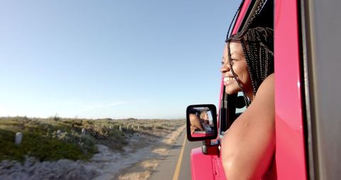 Joyful Young Woman Enjoying Scenic Road Trip Adventure