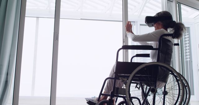 Disabled Senior Woman Using Virtual Reality Headset at Home - Download Free Stock Images Pikwizard.com