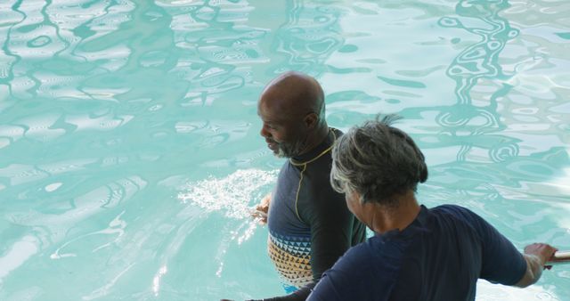 Elderly Couple Enjoying Swim in Pool - Download Free Stock Images Pikwizard.com