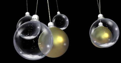 Hanging Christmas Baubles with Falling Snowflakes on Black Background