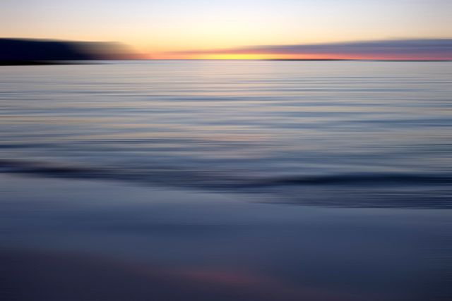 Serene Sunset Over Calm Ocean Waters - Download Free Stock Photos Pikwizard.com
