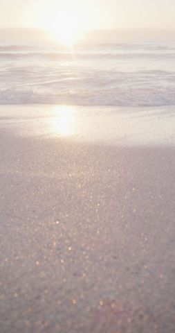 Serene Sunrise on Sandy Beach with Gentle Waves - Download Free Stock Images Pikwizard.com