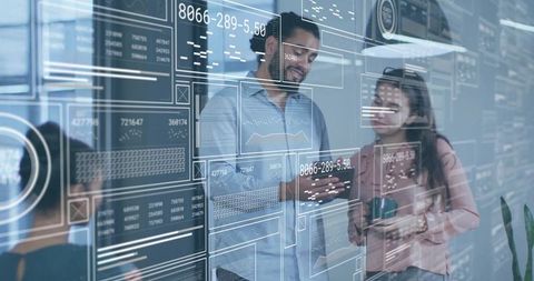 Team discussing data analytics in modern office with digital interface