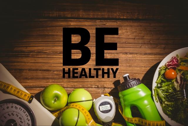 Digital composite of be healthy message against table