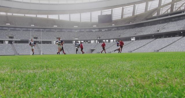 Rugby Players Running in Stadium During Practice Session - Download Free Stock Images Pikwizard.com