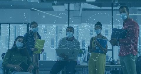 Professionals in surgical masks analyze biotech in modern office