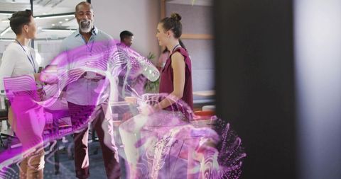 Team collaborating with augmented reality hologram in office lounge showing digital anatomy and data