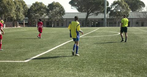 Adult soccer match highlighting teamwork on field
