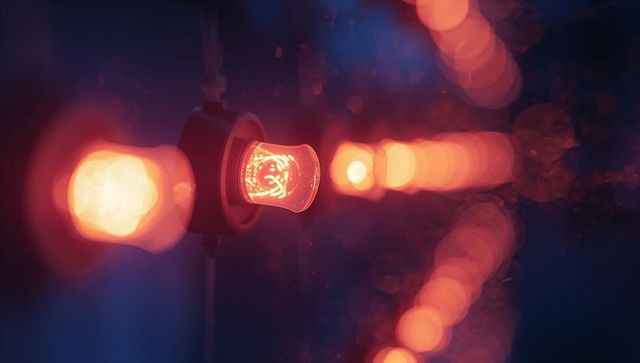 Warm filament bulb glowing in evening ambiance