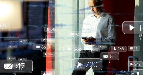 Business traveler leaning at glass reading smartphone with social media notifications