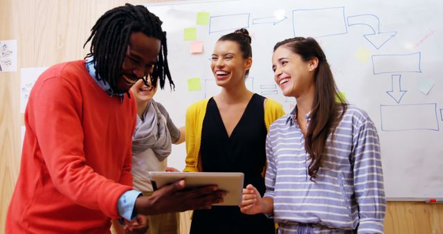 Diverse Team Laughing and Collaborating in Modern Office - Download Free Stock Images Pikwizard.com