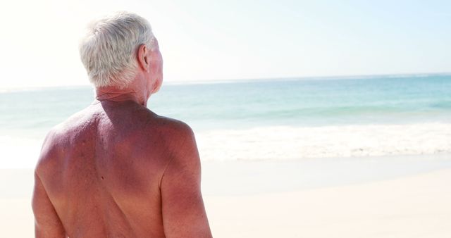 Elderly Man Enjoying Sunny Beach Waves - Download Free Stock Images Pikwizard.com