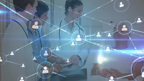 Doctors Collaborating with Technology Over Hospitalized Patient