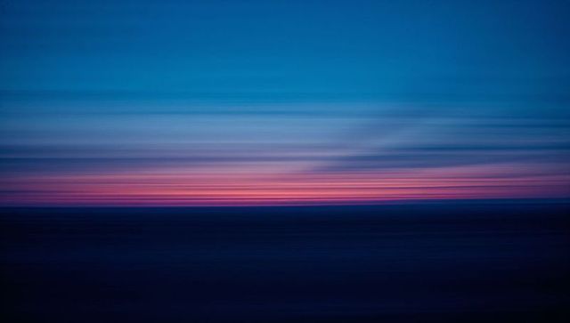 Abstract blurred seascape at dawn with soft gradients