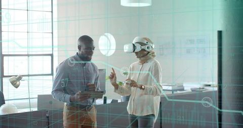 Colleagues Using Augmented Reality in Modern Office