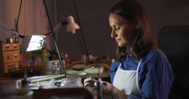 Female Artisan Jewelry Maker Working in Studio Lighting - Download Free Stock Images Pikwizard.com