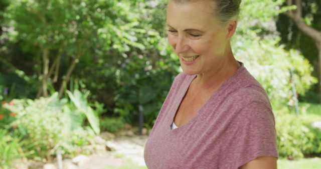 Senior Woman Enjoying Nature Walk in Garden - Download Free Stock Images Pikwizard.com