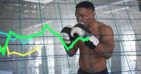 Boxer training with performance graph overlay in gym showing strength, focus and endurance metrics