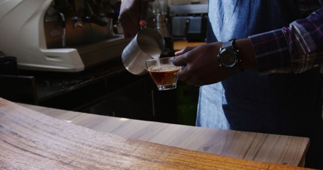 Barista Pouring Milk Into Coffee at Cafe Counter - Download Free Stock Images Pikwizard.com