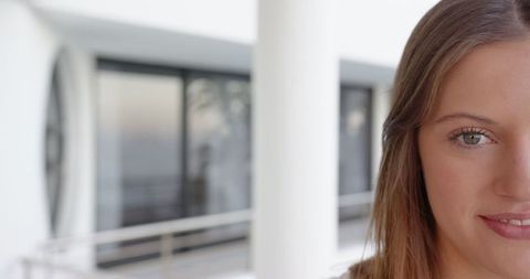 Businesswoman in Contemporary Office Corridor Near Column