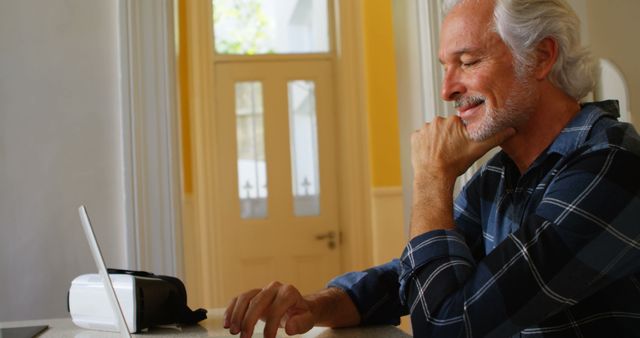 Senior Man Enjoying Work on Laptop at Home - Download Free Stock Images Pikwizard.com