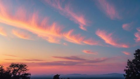 Vibrant Pink and Orange Clouded Sunset Over Rolling Hills