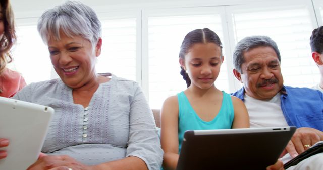 Happy Multigenerational Family Using Digital Tablets Together - Download Free Stock Images Pikwizard.com