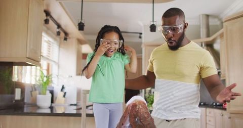 Father And Daughter Exploring Science With Soda Eruption Experiment
