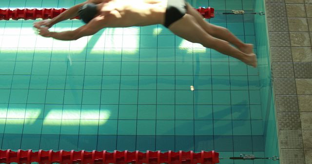 Male Swimmer Diving into Clear Swimming Pool Racing Lane - Download Free Stock Images Pikwizard.com