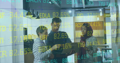 Diverse Business Team Analyzing Financial Data Through Laptop