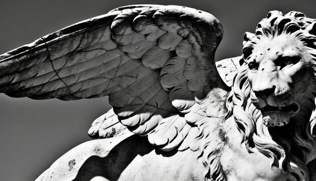 Winged lion marble sculpture close-up showing feathered wing and weathered mane monochrome