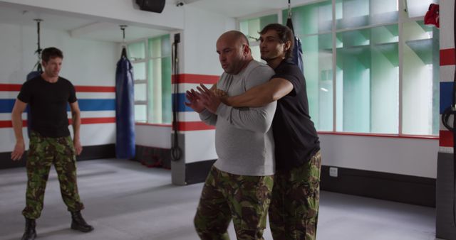 Martial Arts Instructor Teaching Self-Defense Techniques in Class - Download Free Stock Images Pikwizard.com