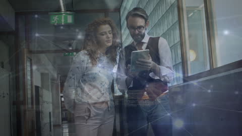 Business Professionals Using Digital Tablet with Futuristic Interface