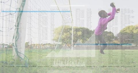 Teen Goalkeeper Saving Soccer Ball with Statistical Overlay