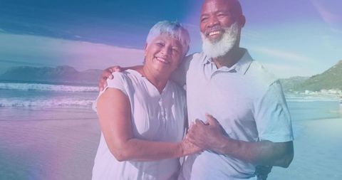 Senior Multicultural Couple Embracing on Sunny Beach