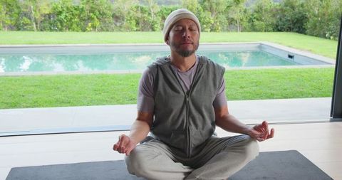 Serene Meditation by Indoor Pool in Modern Home