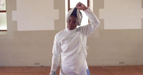 Confident Female Fencer Holding Epee in Training